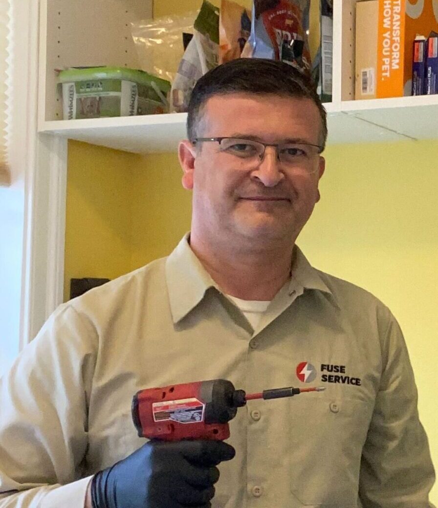 Fuse Tech holding a drill appliance repair fairfax