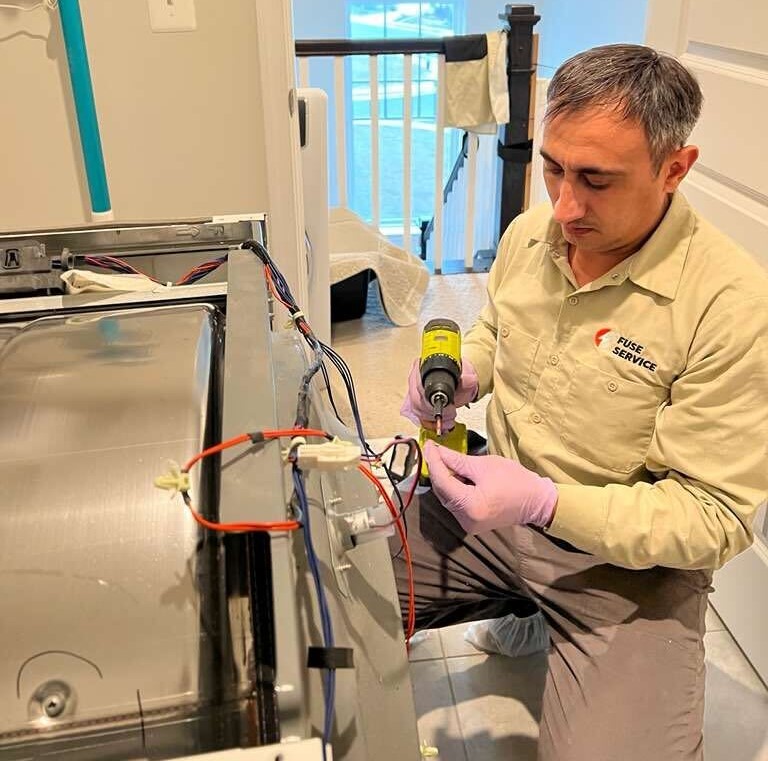 Technician repairing appliance repair ellicott city md